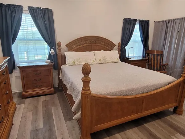 a view of washer and dryer with wooden floor
