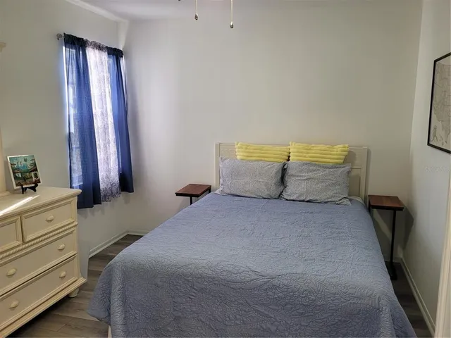 a bedroom with a bed and a closet