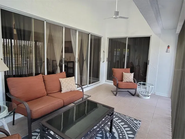 a living room with furniture and a window