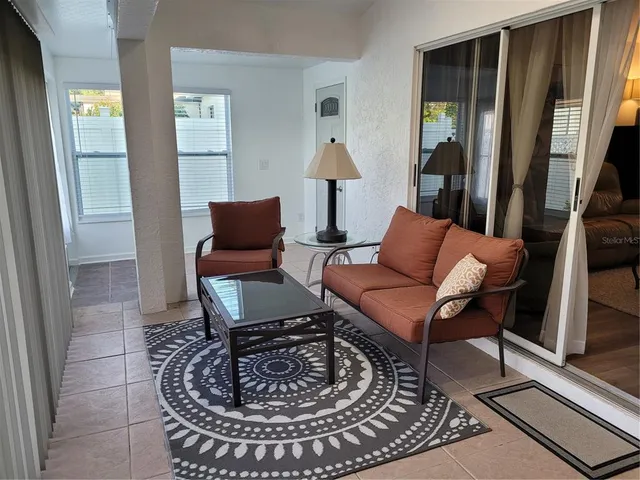 a living room with furniture and a window