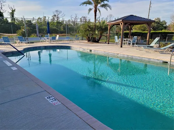 a view of a swimming pool with a patio