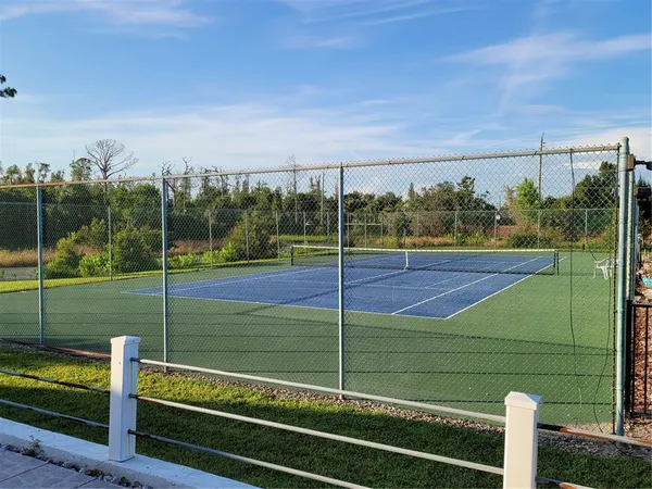 a view of a room with wooden floor and fence