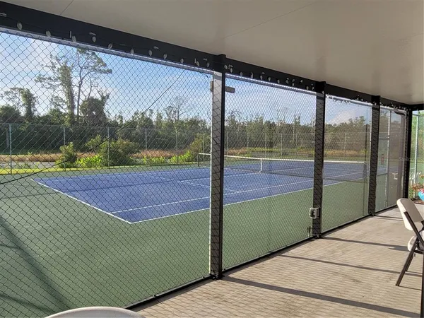 a view of a dining room with furniture and window
