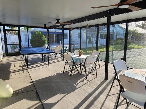 a view of a swimming pool with a patio