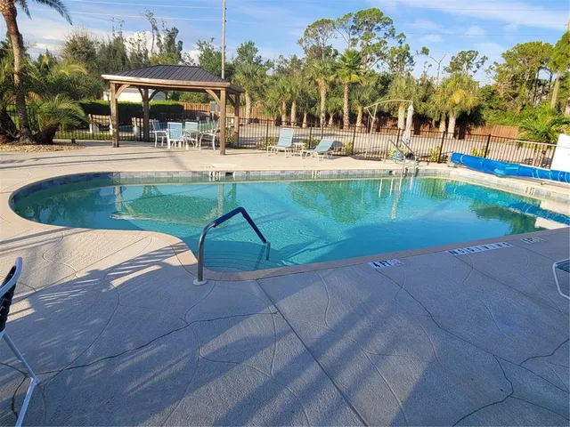 a view of a swimming pool with a patio