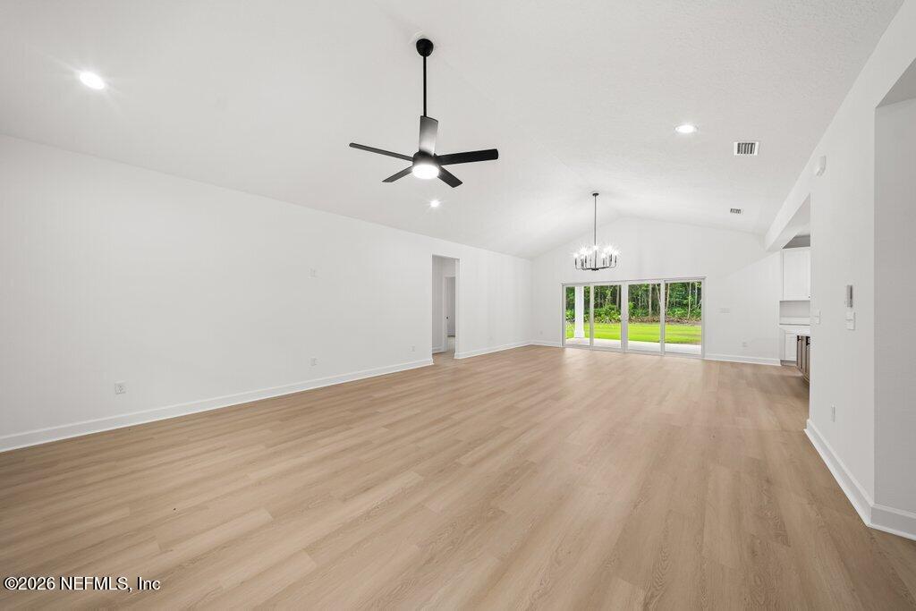 2318 Steel Bridge Road Macclenny, FL 32063 - Photo 18 of 39 a view of an empty room with a window and wooden floor