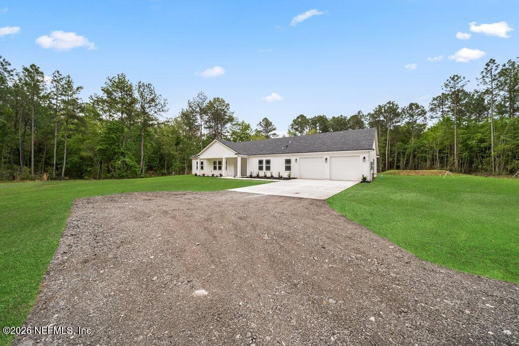 2318 Steel Bridge Road Macclenny, FL 32063 - Photo 2 of 39 a view of an house with backyard and garden