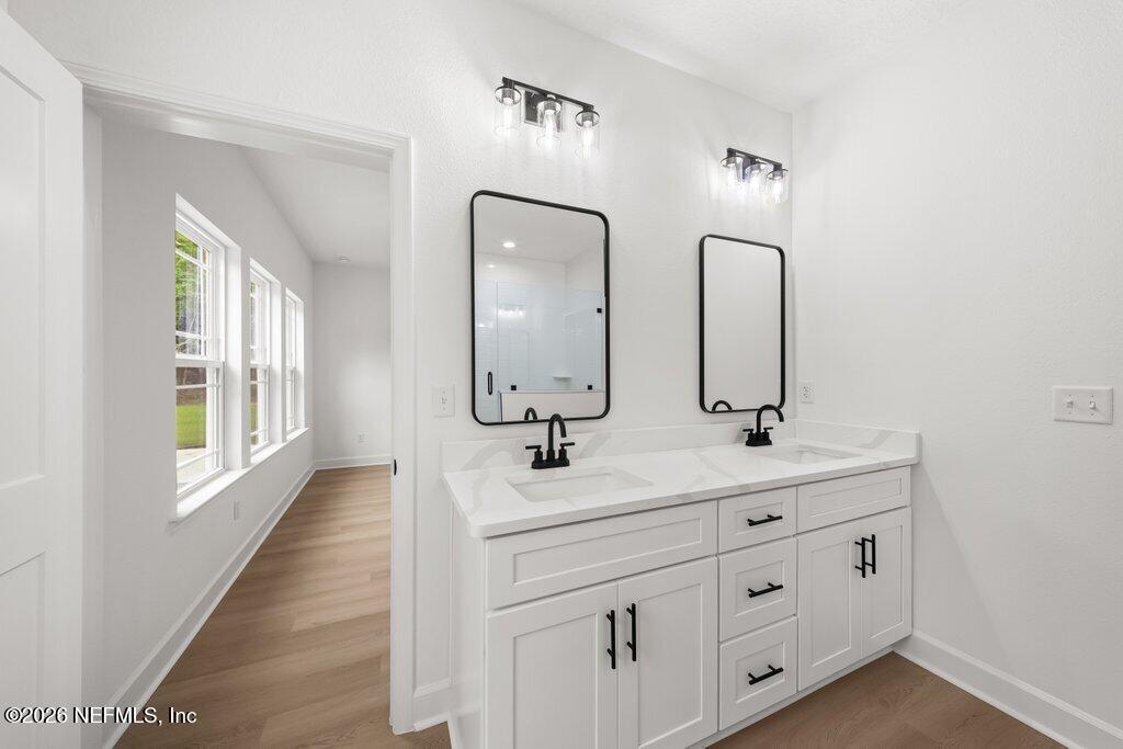 2318 Steel Bridge Road Macclenny, FL 32063 - Photo 23 of 39 a bathroom with double sink and a mirror