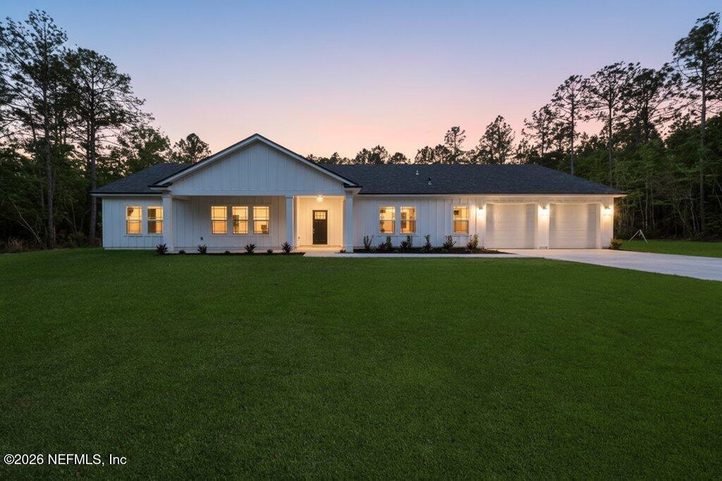 2318 Steel Bridge Road Macclenny, FL 32063 - Photo 3 of 39 a front view of house with a garden