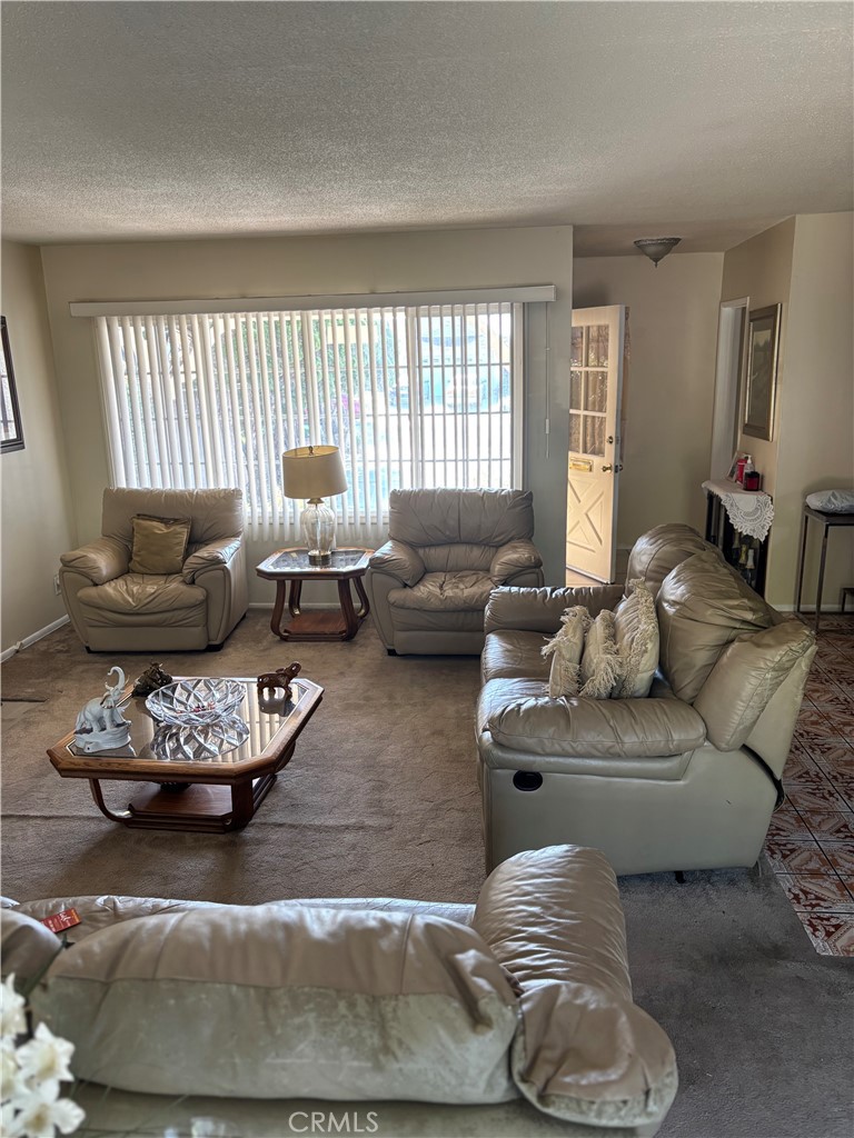 2403 West 116th Street Hawthorne, CA 90250 - Photo 11 of 15 a living room with furniture and a large window