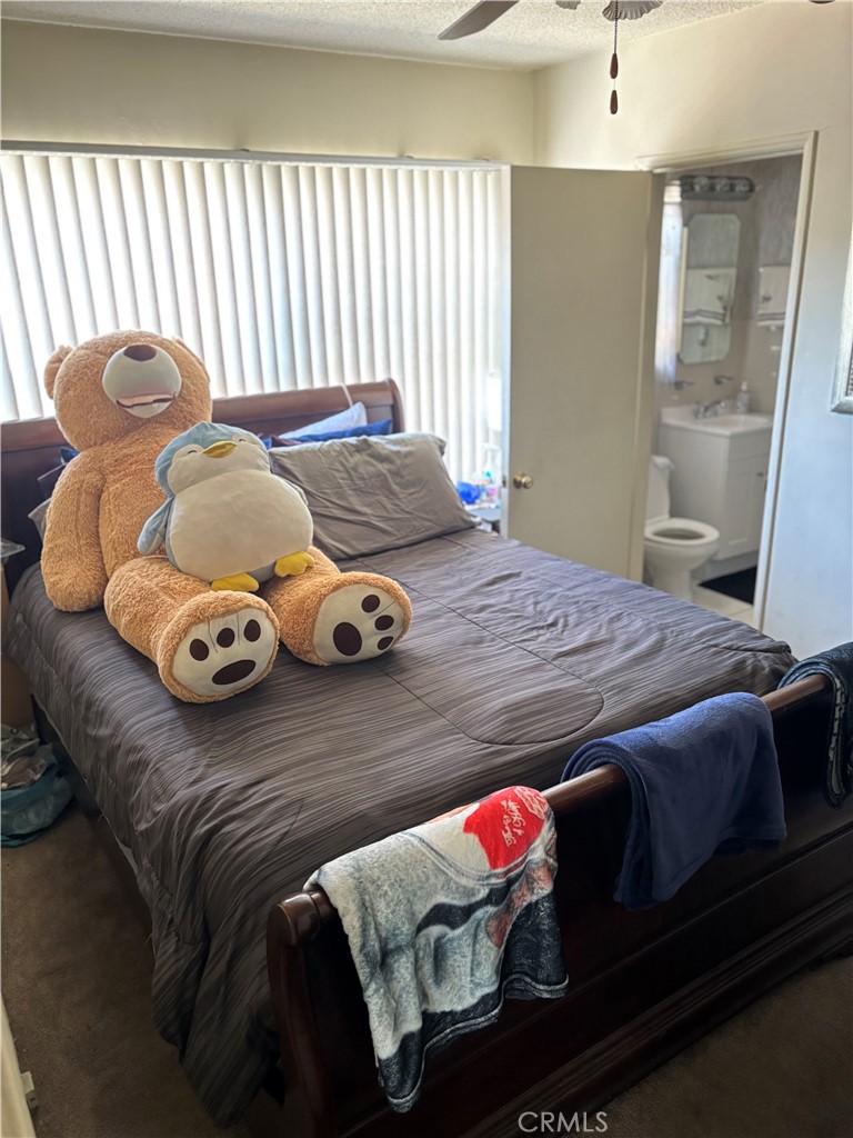 2403 West 116th Street Hawthorne, CA 90250 - Photo 15 of 15 a bedroom with a bed and wooden floor