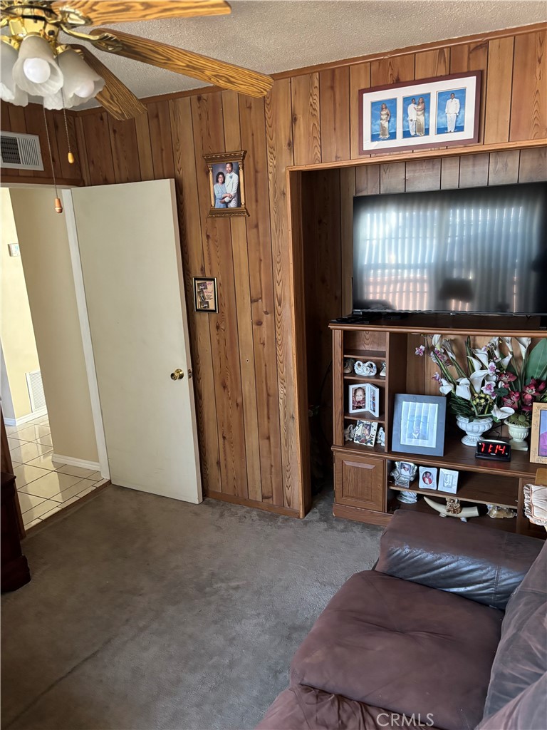2403 West 116th Street Hawthorne, CA 90250 - Photo 7 of 15 a living room with furniture and a flat screen tv