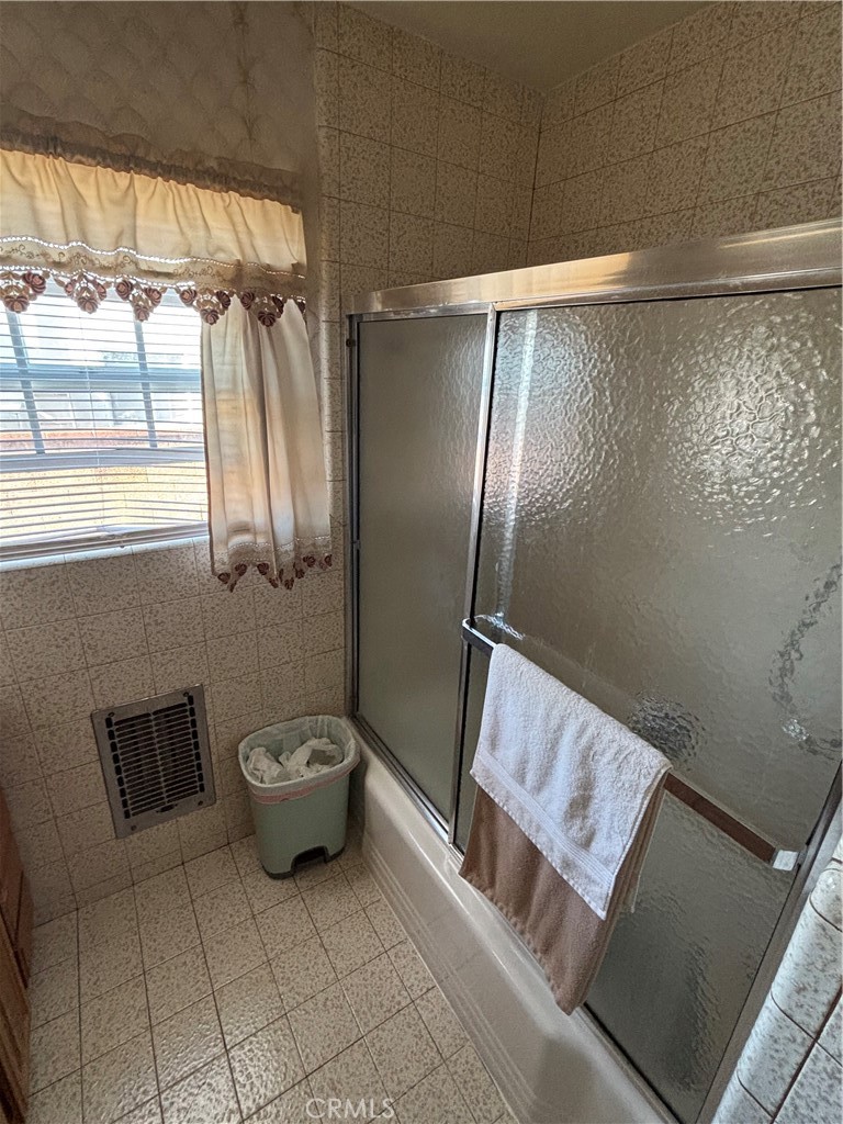 2403 West 116th Street Hawthorne, CA 90250 - Photo 8 of 15 a bathroom with a sink and a mirror