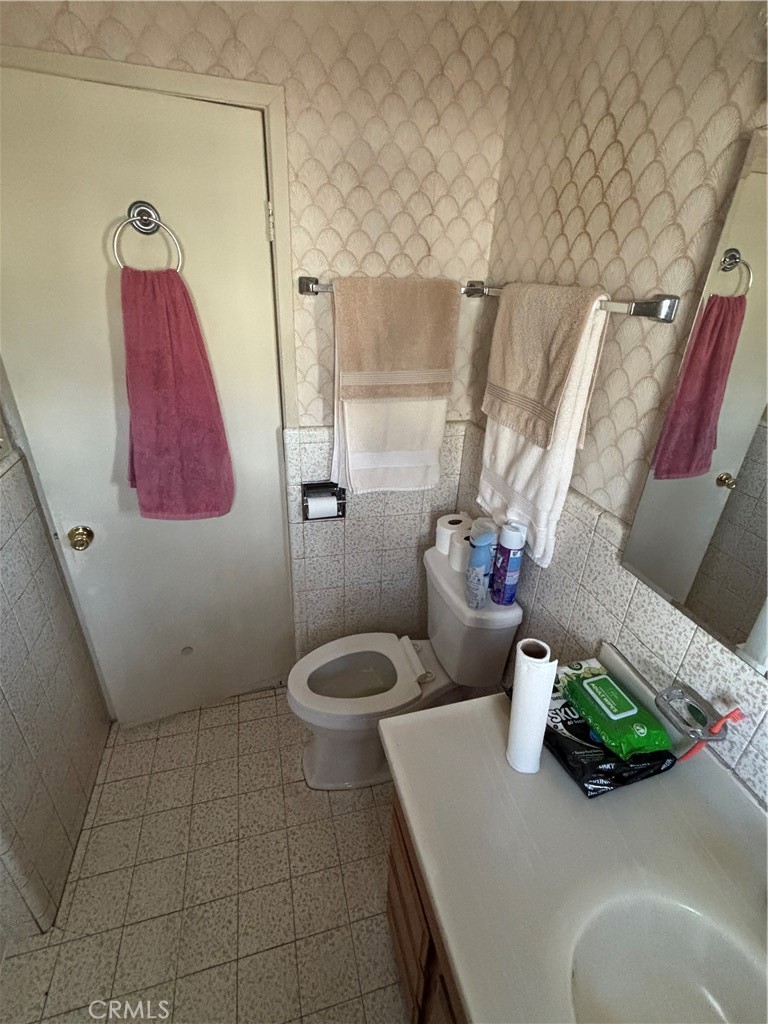 2403 West 116th Street Hawthorne, CA 90250 - Photo 9 of 15 a bathroom with a sink a toilet and shower