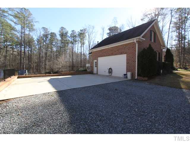 13204 Old Creedmoor Road Raleigh, NC 27613 - Photo 20 of 24 Gravel driveway with large concrete parking pad