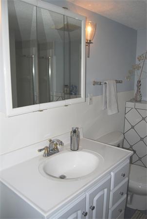 49 Dix Rd Extension Woburn, MA 01801 - Photo 15 of 19 a bathroom with a sink and a mirror