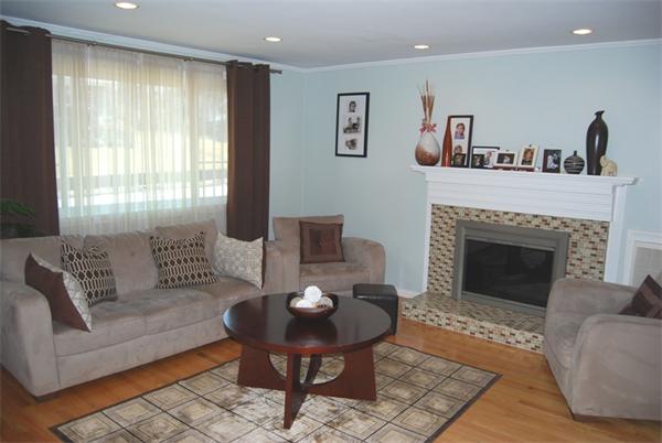 49 Dix Rd Extension Woburn, MA 01801 - Photo 3 of 19 a living room with furniture and a fireplace