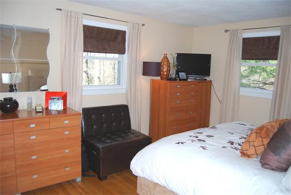 49 Dix Rd Extension Woburn, MA 01801 - Photo 8 of 19 a bedroom with a bed and flat screen tv