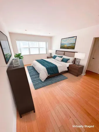 a bedroom with a bed window and couch