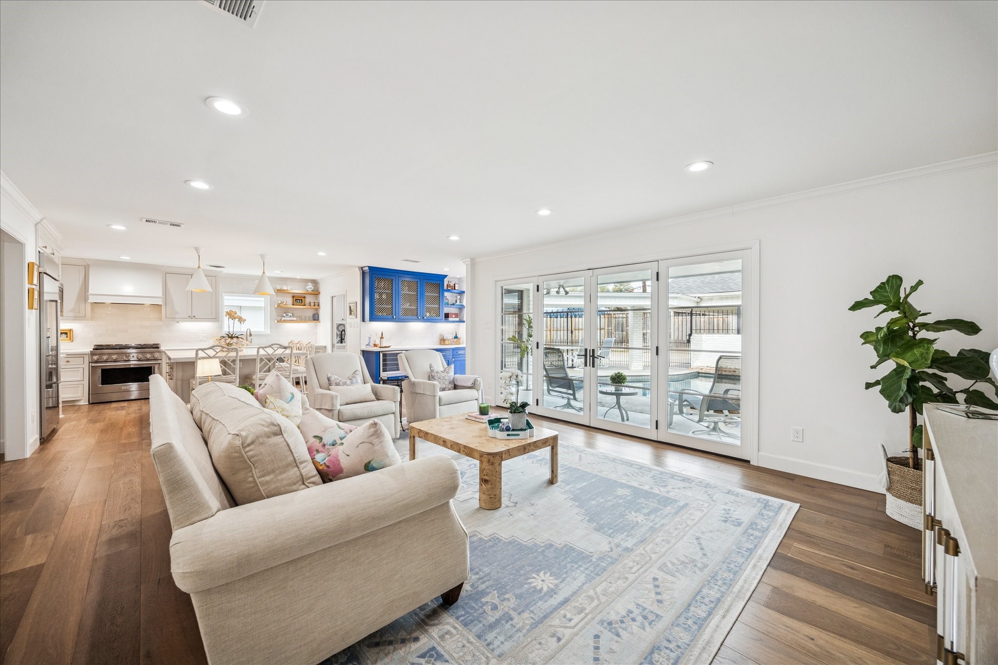7906 Meadowbriar Lane Houston, TX 77063 - Photo 10 of 34 The living room opens to the kitchen and dining room, bar area allowing for a great gathering space for family and friends. Fully updated and ready to move in.