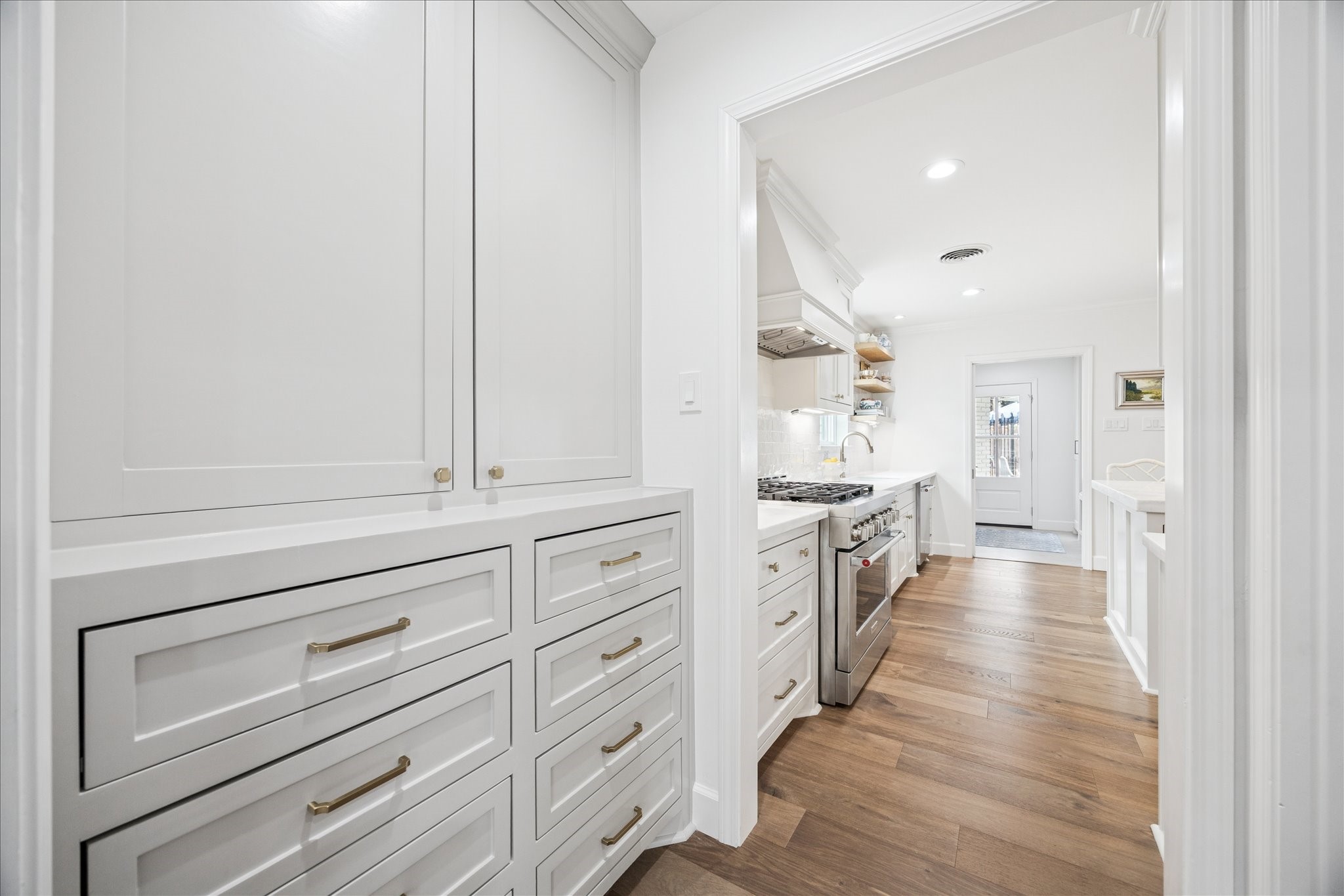 7906 Meadowbriar Lane Houston, TX 77063 - Photo 17 of 34 Between the kitchen and home office is a huge walk-in pantry and butler's pantry with great storage space.