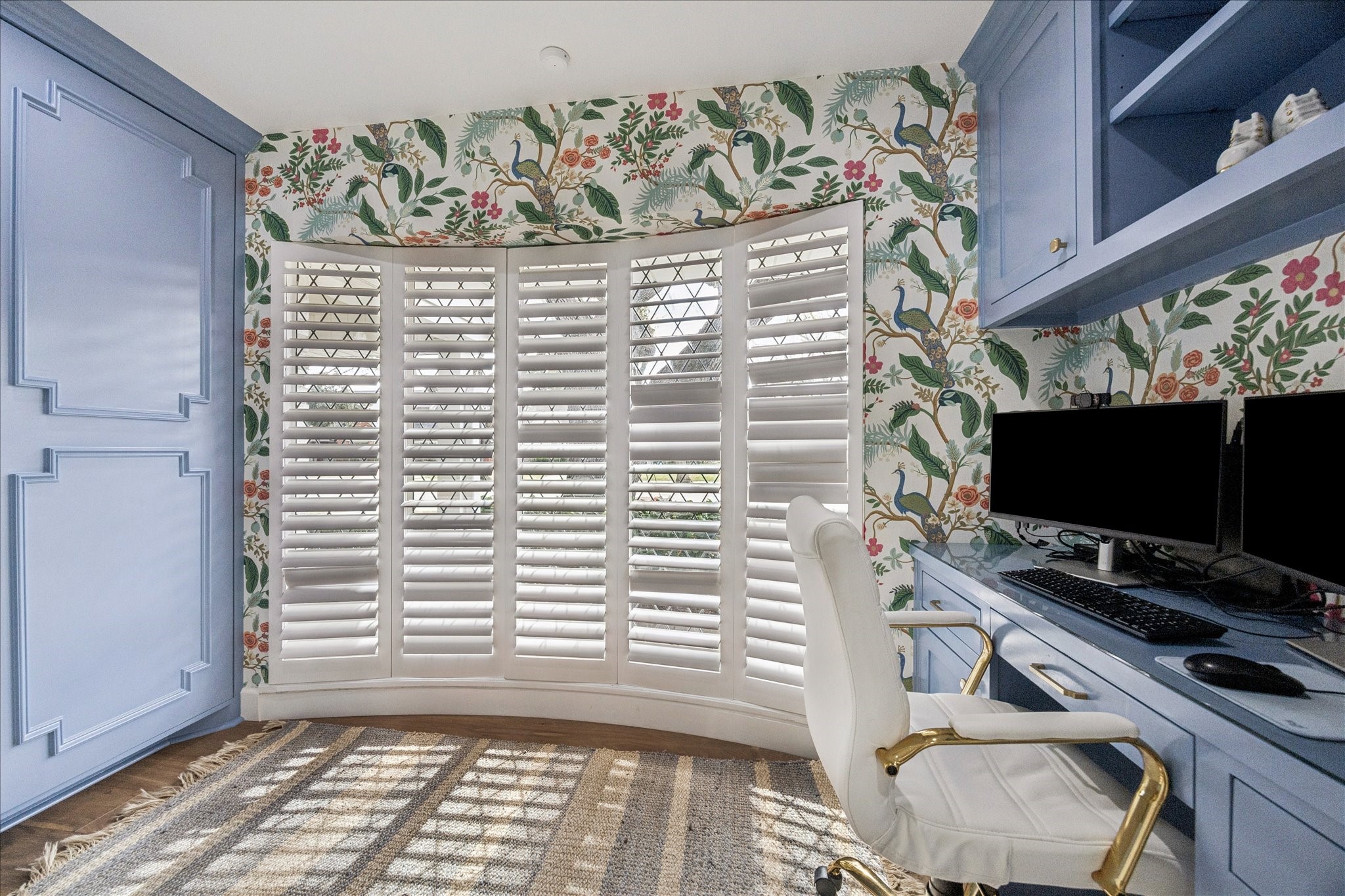 7906 Meadowbriar Lane Houston, TX 77063 - Photo 18 of 34 Located off the kitchen, this charming home office features Rifle Paper Co. wallpaper, custom painted built-in cabinetry and storage. It's a perfect space for work, studying or crafting.