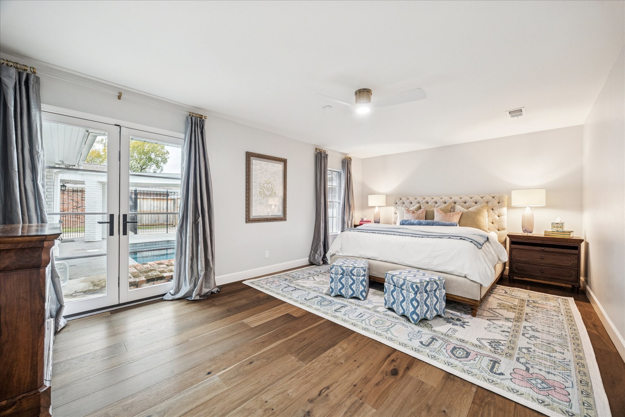 7906 Meadowbriar Lane Houston, TX 77063 - Photo 3 of 34 The master retreat is located in the back of the home and features french doors that open to your pool. The large en-suite featuring two vanities and separate closets is a dream!