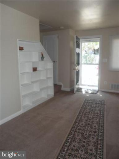 1037 Stamford Road Baltimore, MD 21229 - Photo 4 of 15 Living room with built-in bookcases