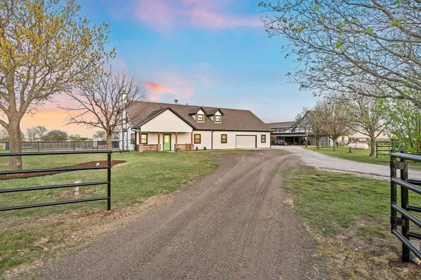 a view of house with yard