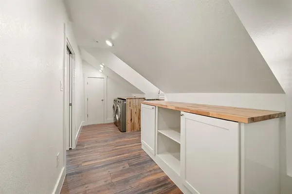 a view of a kitchen with furniture and a kitchen