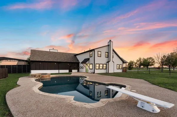 a view of a house with a sink and a yard