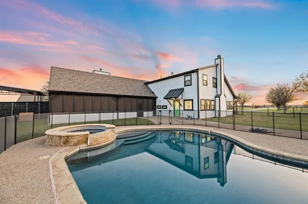 a view of a street with a garden