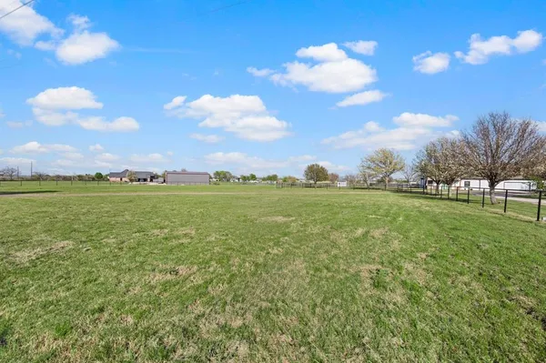 a view of a golf course with a lake