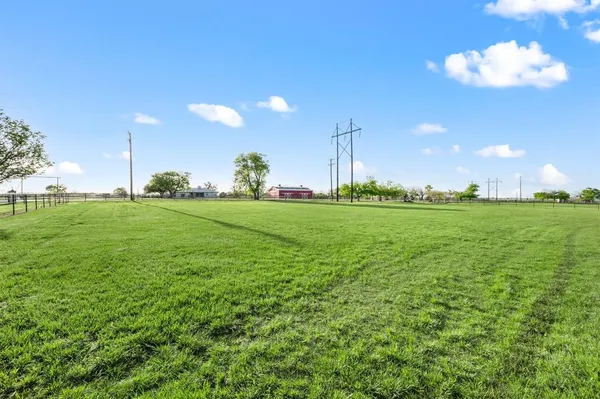 a view of a golf course with a lake