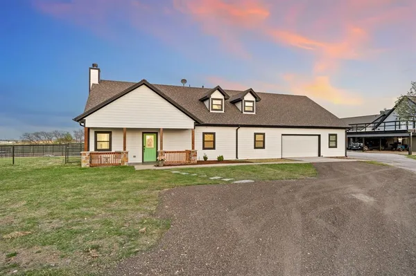a view of a road with a big yard