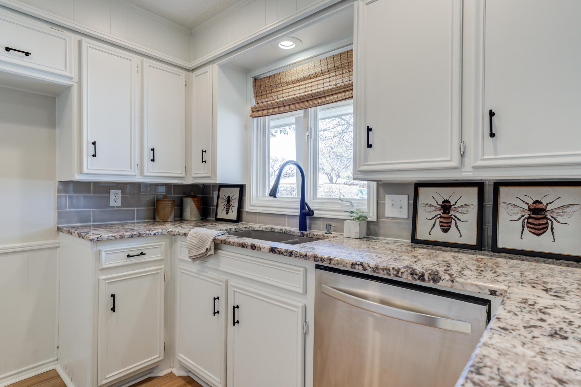 3405 91st Street Lubbock, TX 79423 - Photo 20 of 41 a kitchen with granite countertop white cabinets and white appliances