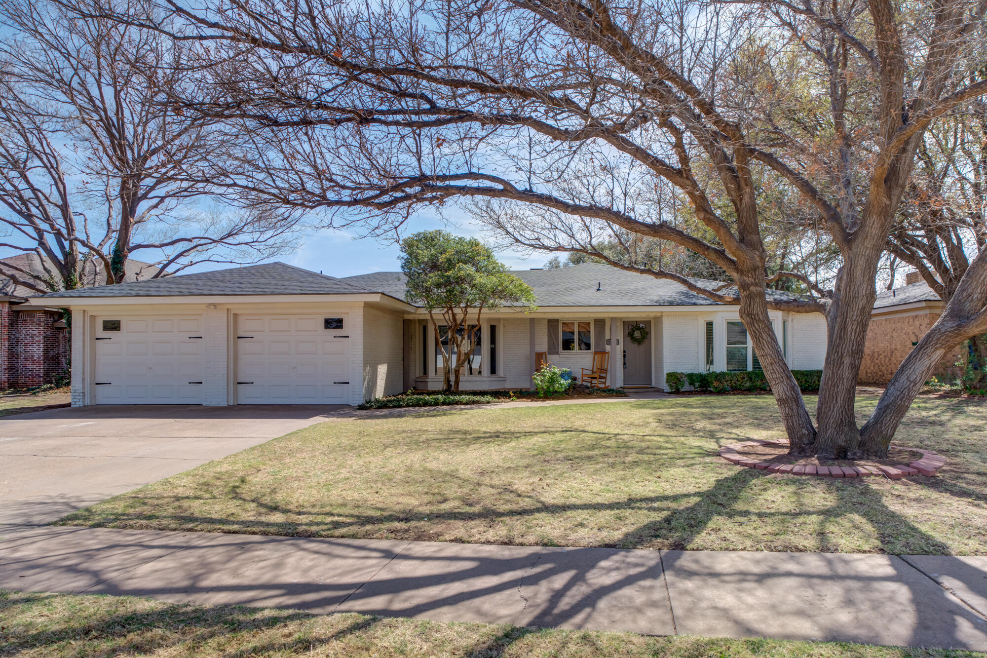 3405 91st Street Lubbock, TX 79423 - Photo 2 of 41 a view of a house with a yard and large tree