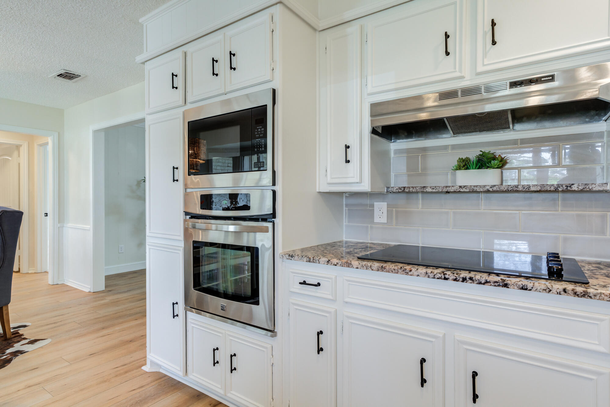 3405 91st Street Lubbock, TX 79423 - Photo 23 of 41 a kitchen with stainless steel appliances granite countertop a stove and a refrigerator