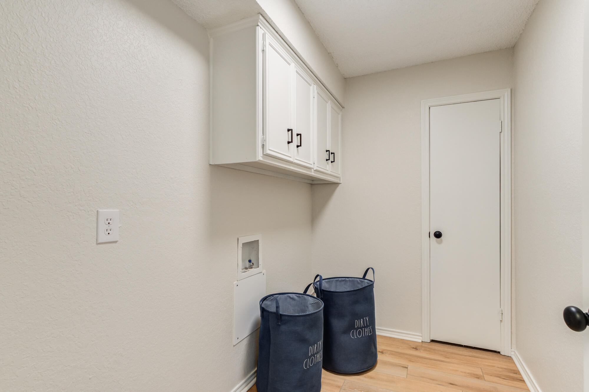 3405 91st Street Lubbock, TX 79423 - Photo 26 of 41 a room with cabinets and dust bin