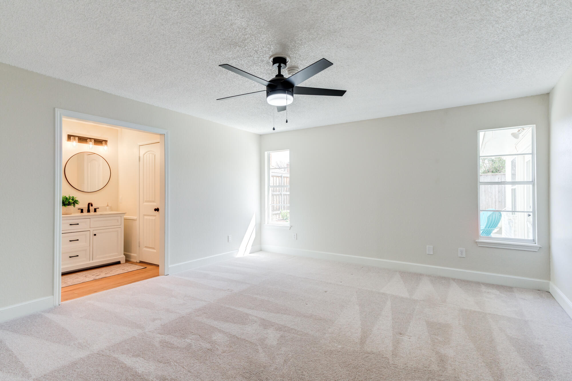 3405 91st Street Lubbock, TX 79423 - Photo 27 of 41 a view of a livingroom with a ceiling fan and window