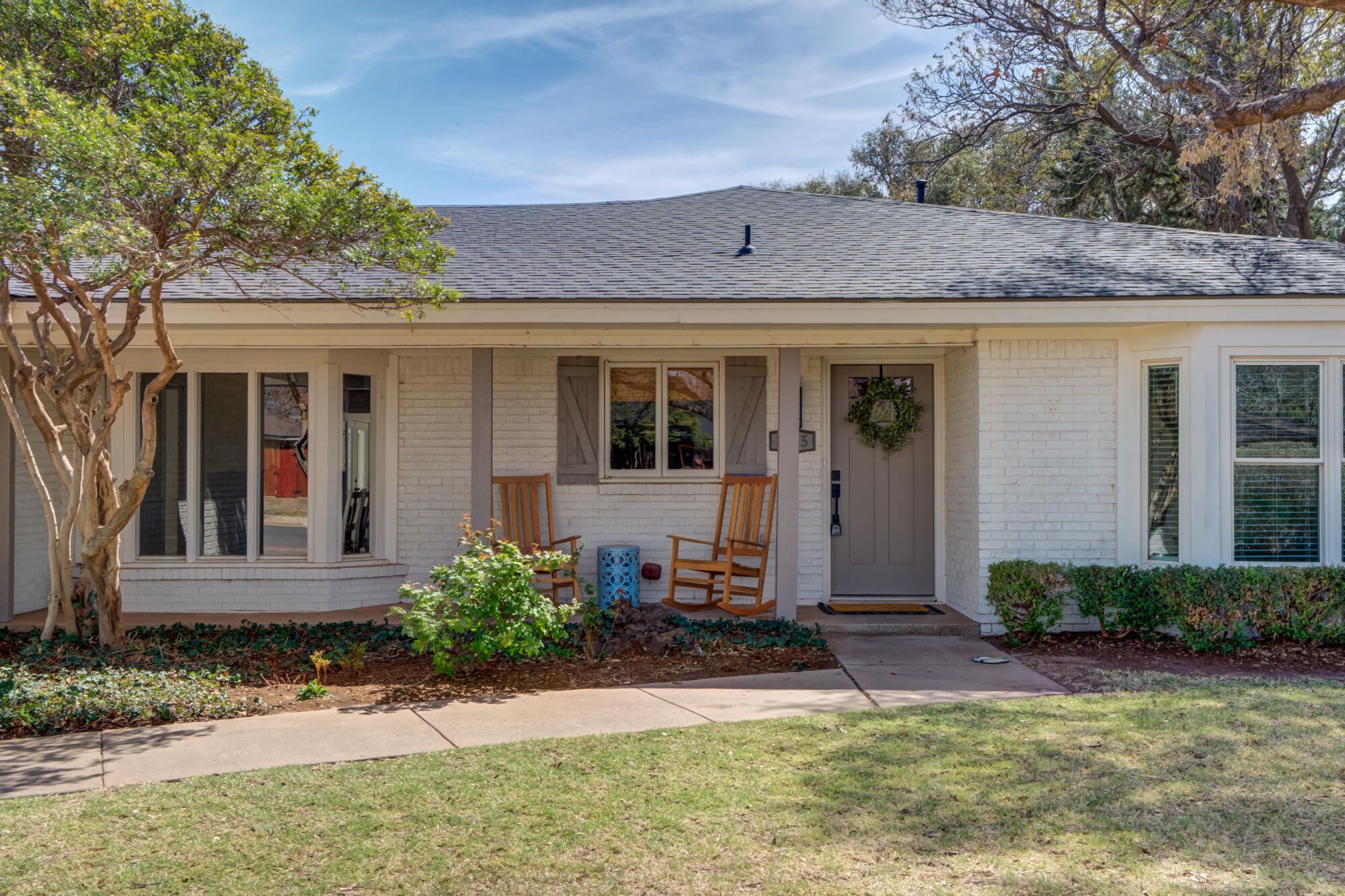 3405 91st Street Lubbock, TX 79423 - Photo 3 of 41 a front view of a house with garden
