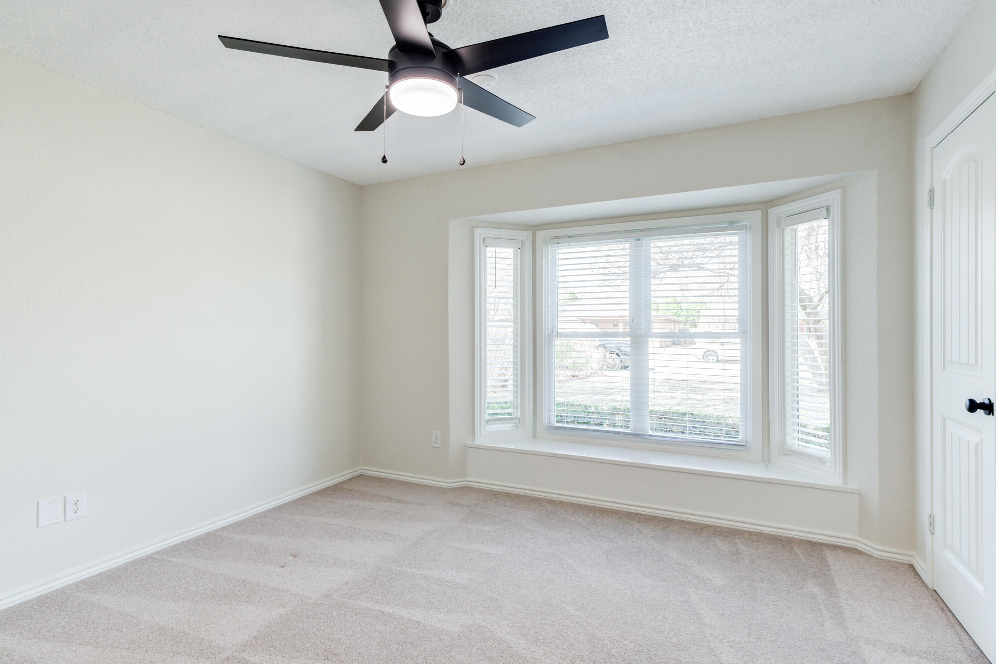 3405 91st Street Lubbock, TX 79423 - Photo 32 of 41 an empty room with a window and a fan