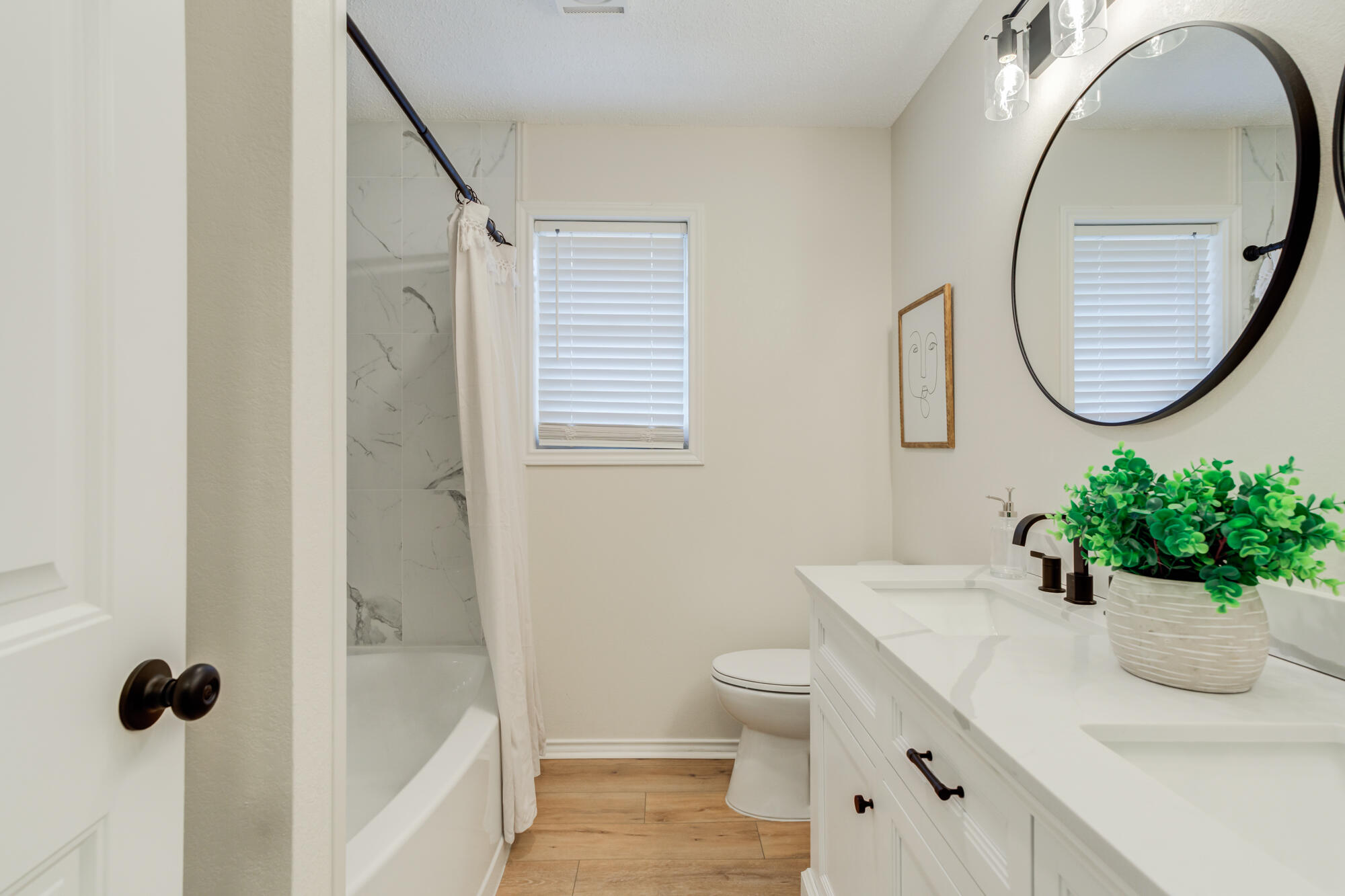 3405 91st Street Lubbock, TX 79423 - Photo 34 of 41 a bathroom with a sink toilet and a mirror