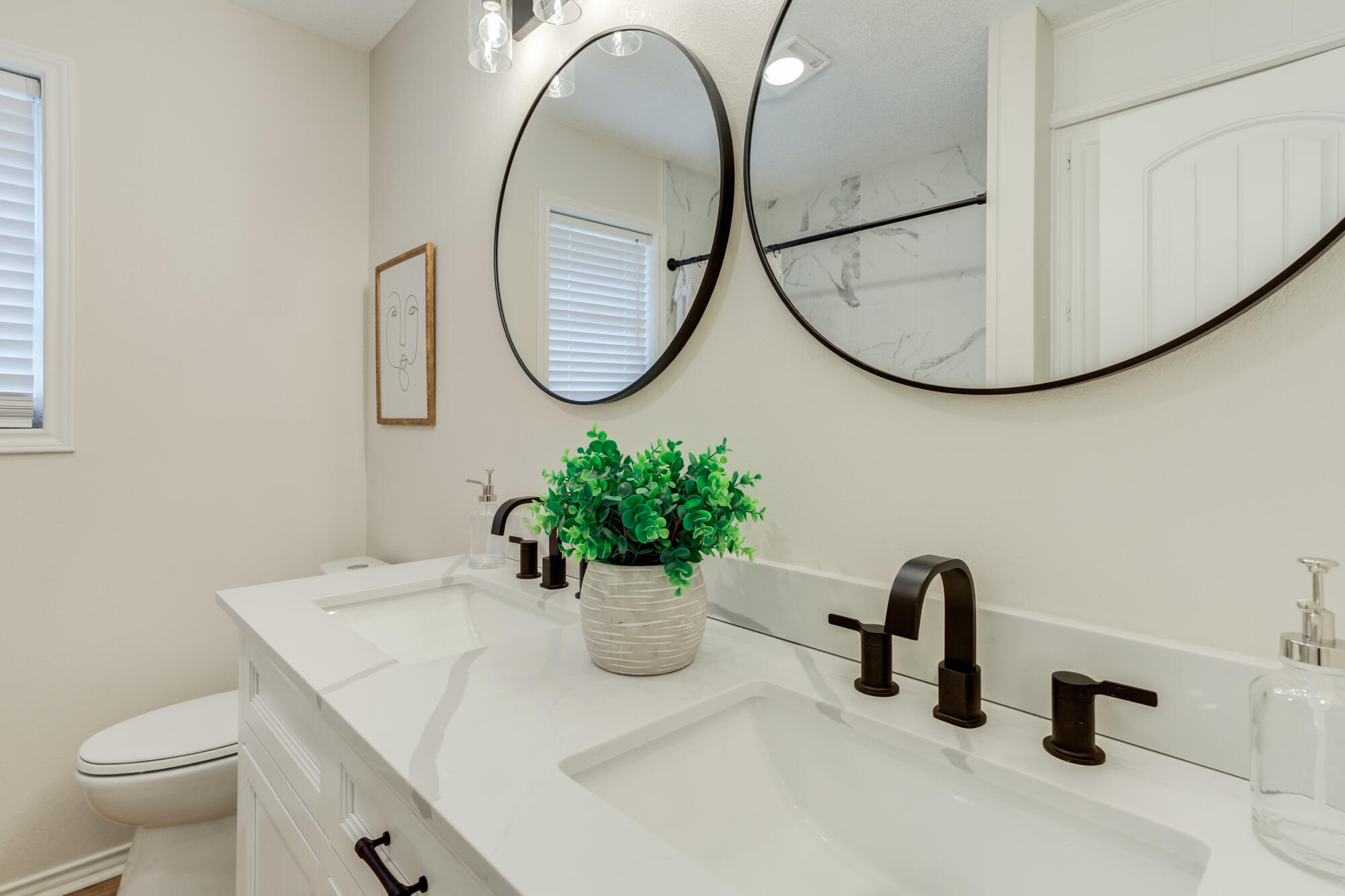 3405 91st Street Lubbock, TX 79423 - Photo 35 of 41 a bathroom with a sink mirror and toilet
