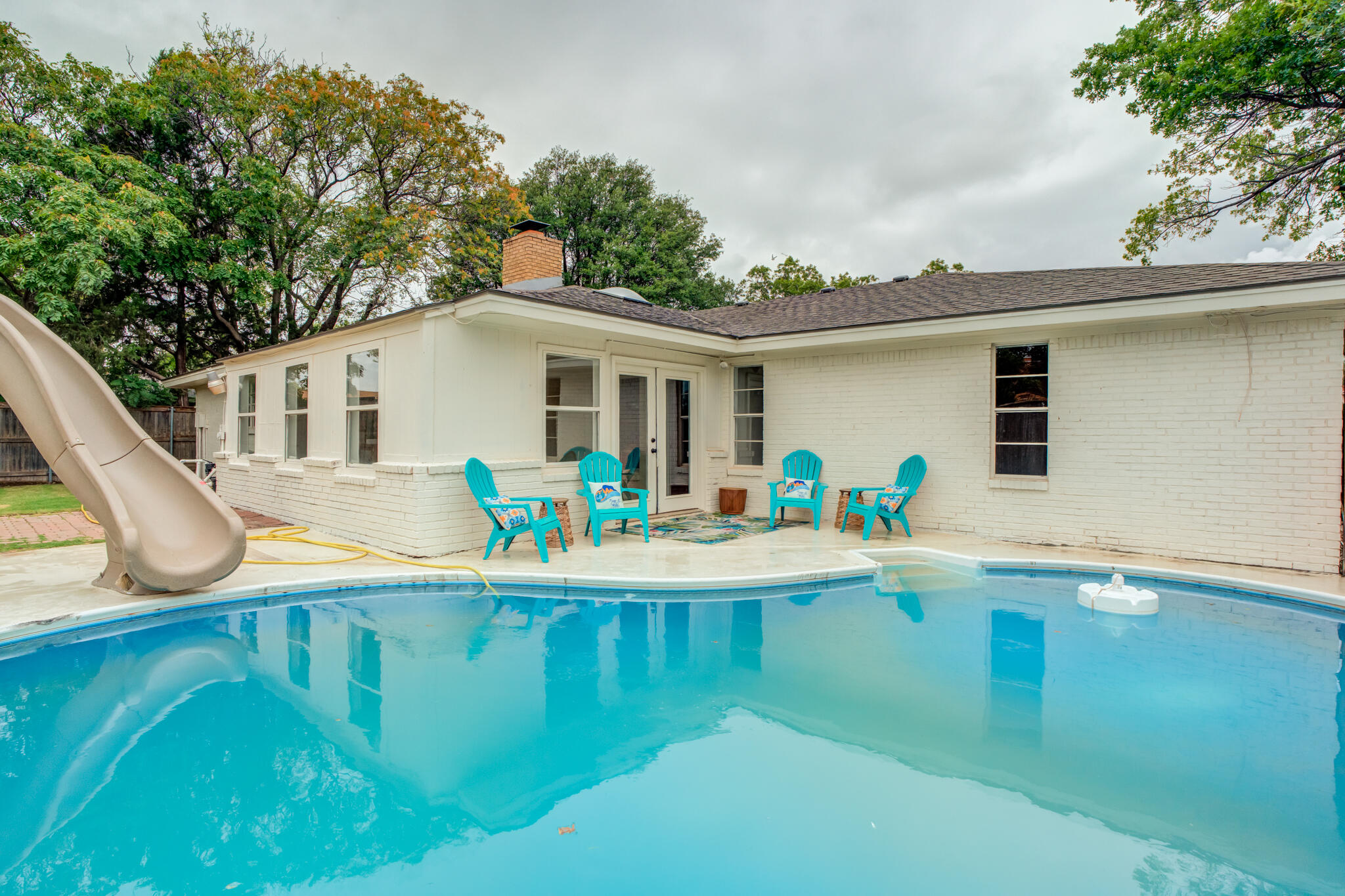 3405 91st Street Lubbock, TX 79423 - Photo 40 of 41 a view of a house with pool and a yard