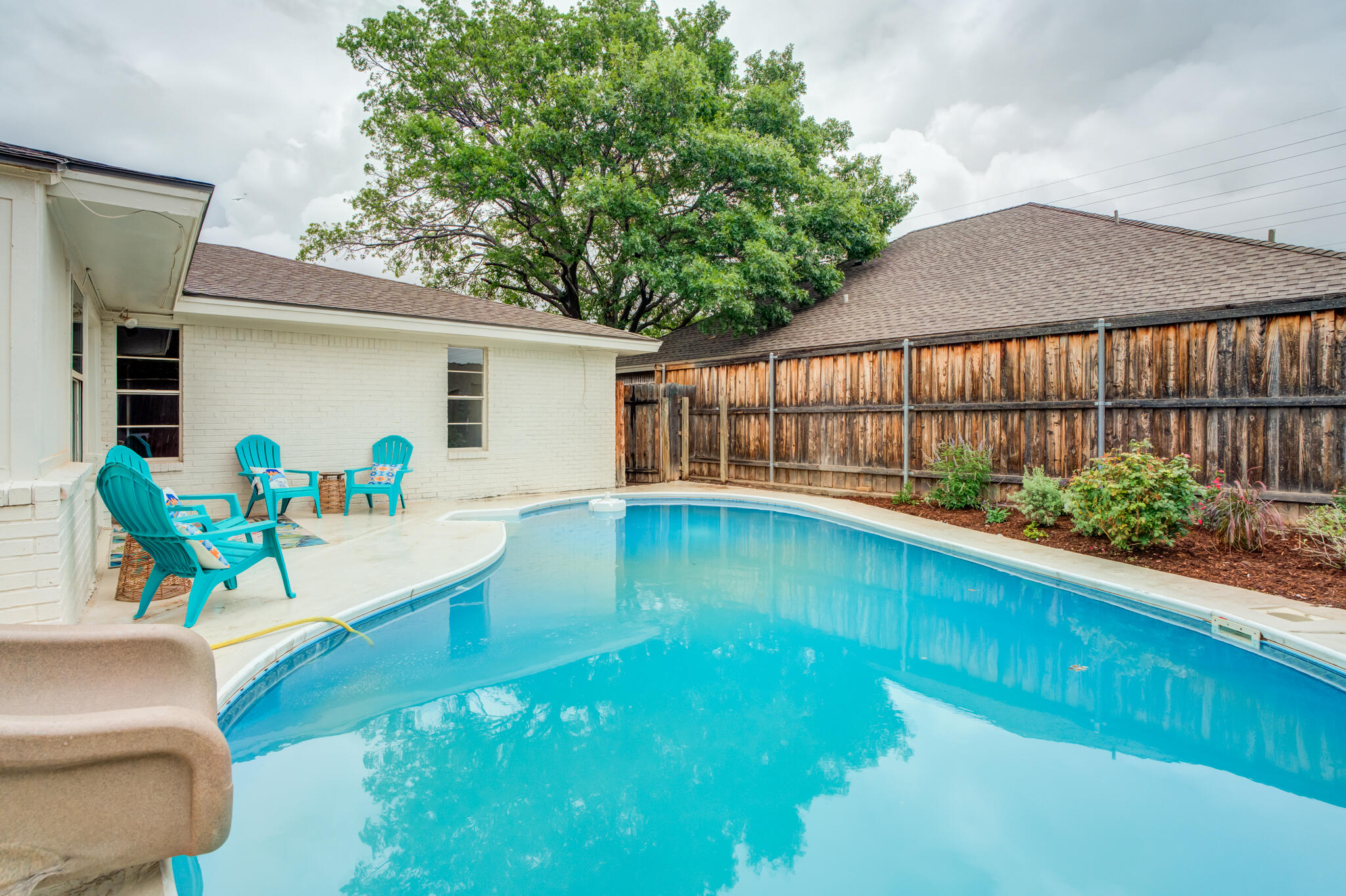 3405 91st Street Lubbock, TX 79423 - Photo 41 of 41 a view of a swimming pool with a patio
