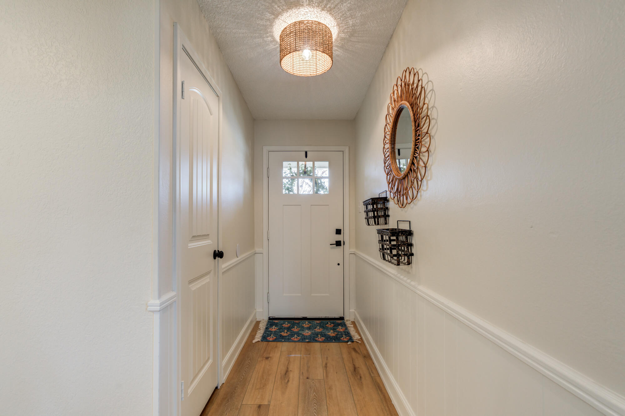 3405 91st Street Lubbock, TX 79423 - Photo 5 of 41 a view of a hallway with wooden floor and staircase