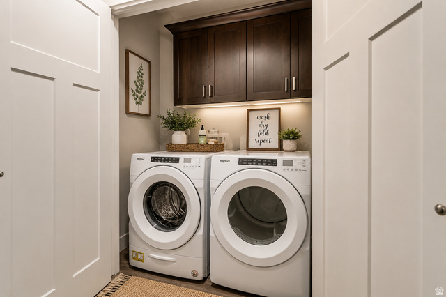 4572 Flower Point Eagle Mountain, UT 84005 - Photo 62 of 62 Dedicated laundry area featuring dark wood-finish cabinetry with undermount lighting