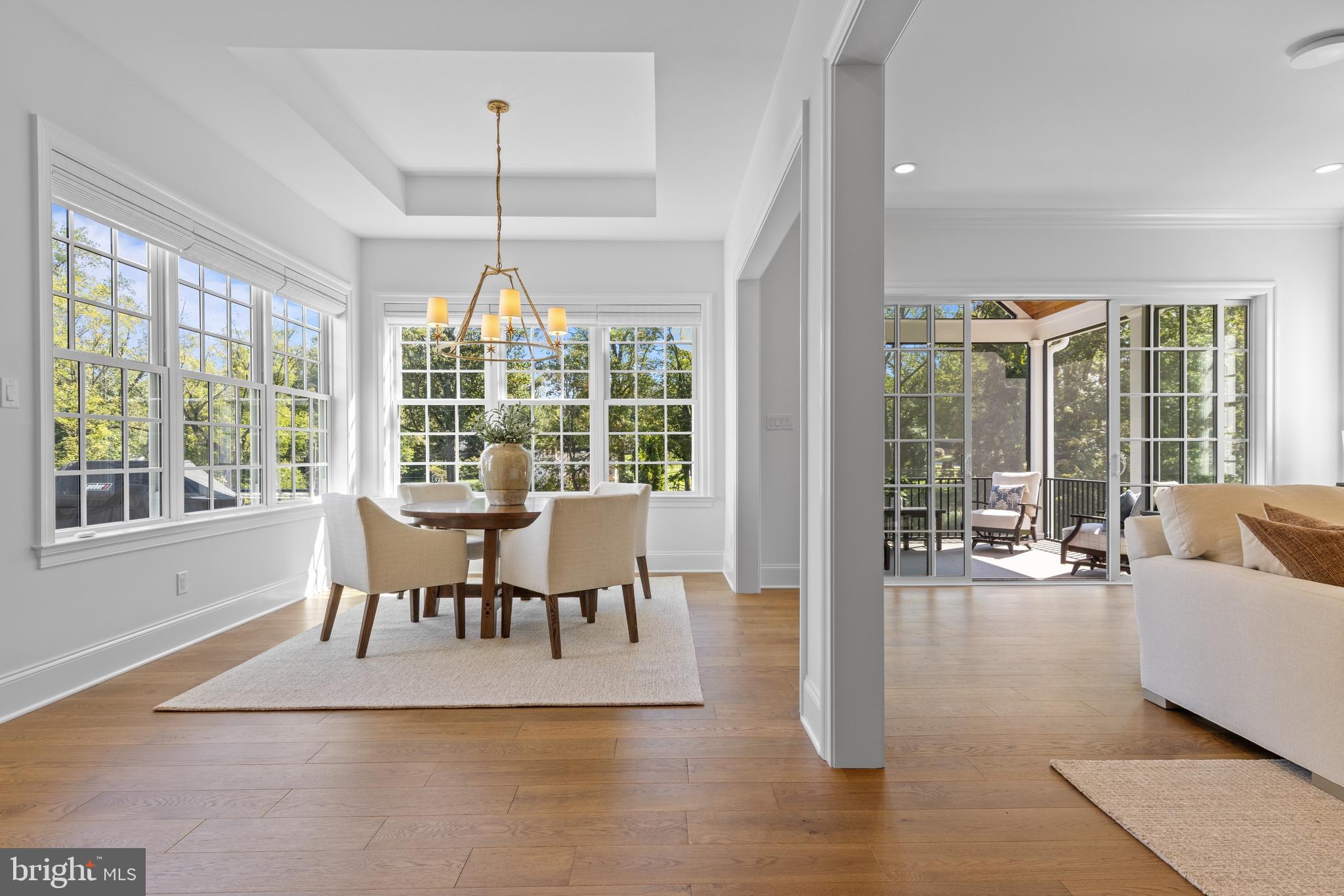 1052 Prescott Road Berwyn, PA 19312 - Photo 14 of 65 a view of a dining room with furniture wooden floor and chandelier