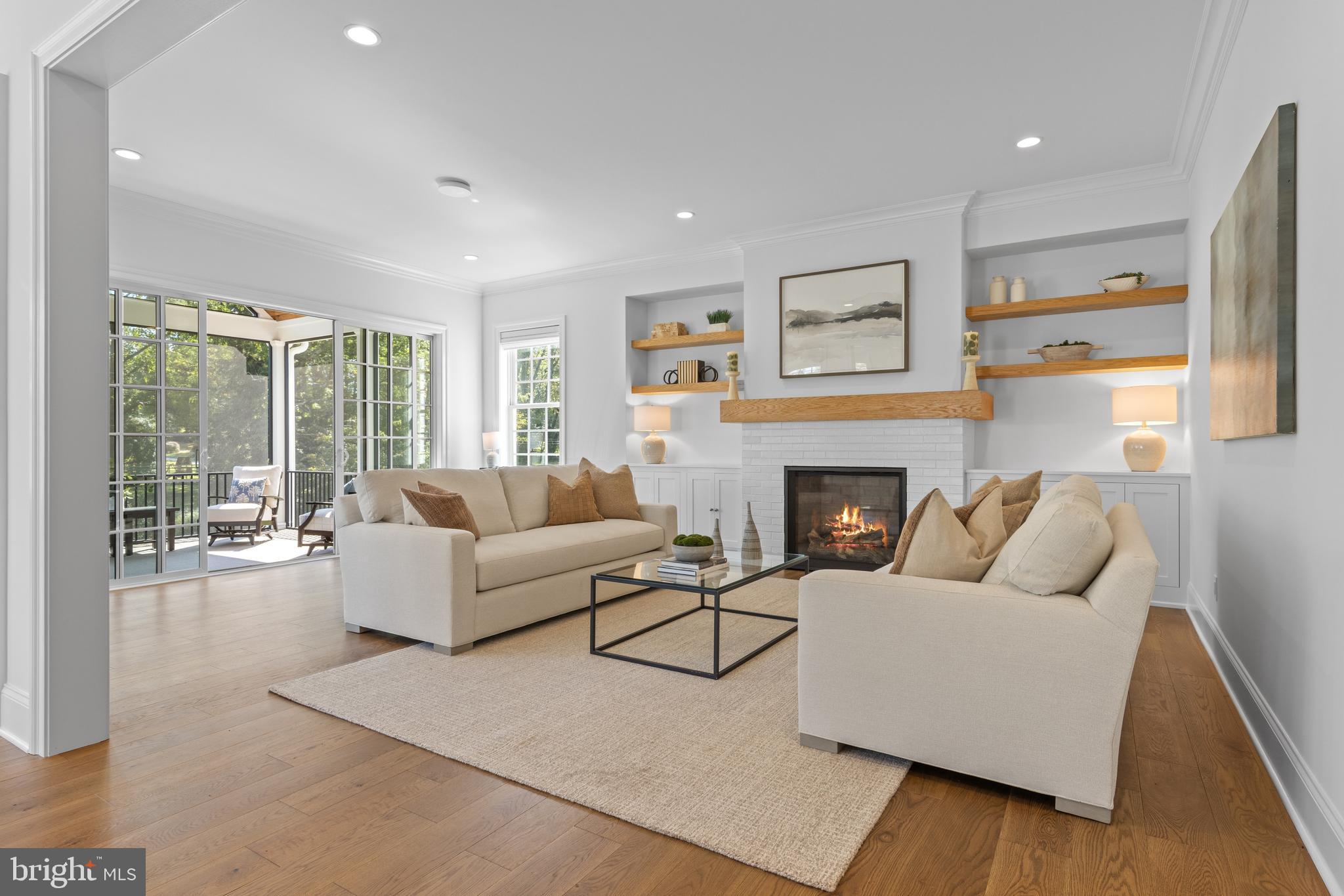 1052 Prescott Road Berwyn, PA 19312 - Photo 19 of 65 a living room with furniture and a fireplace